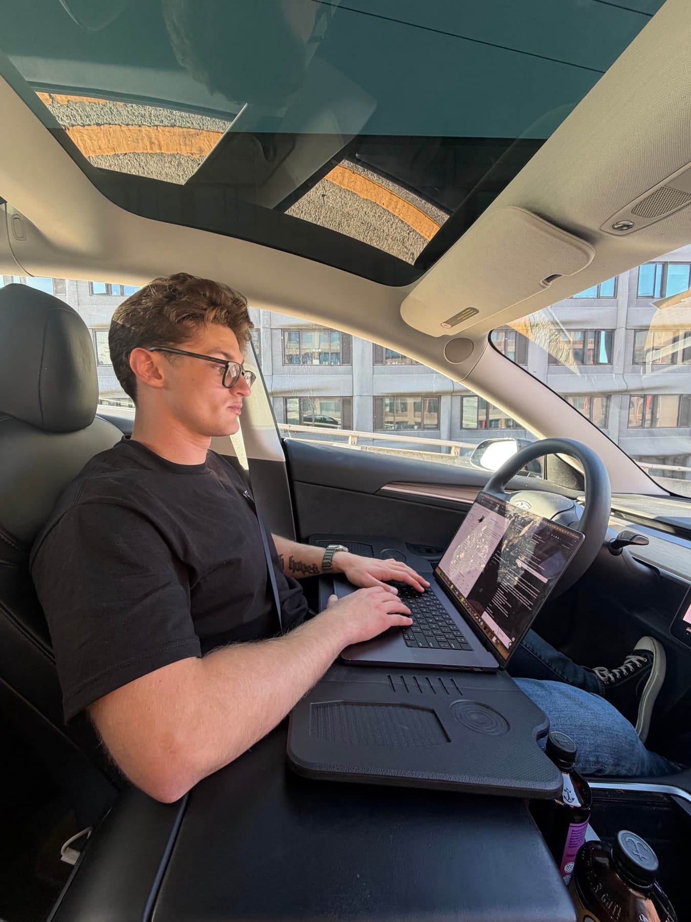 A Prox founder working with coding tools between customer visits
