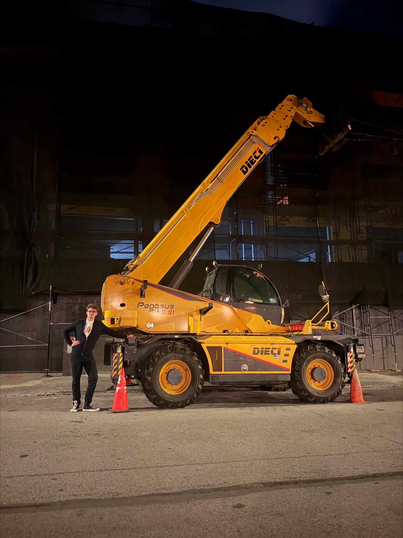 A Prox founder beside heavy equipment during field work